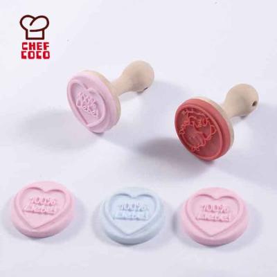 China Viable Silicone Cake Stamp With Wooden Handle Cookie Stamper Stamp for sale