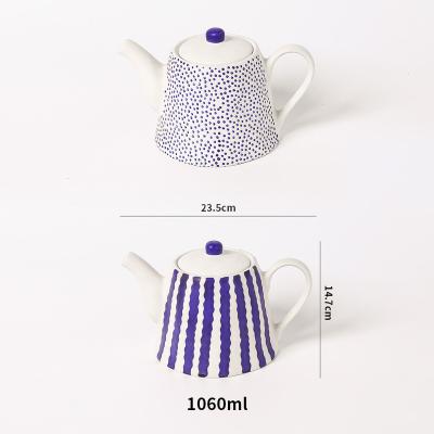 China Sustainable 36oz Wholesale Ceramic Infusion Teapots Spotted Porcelain Tea Kettle with Lid for sale