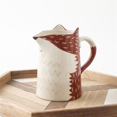 China Sustainable Wholesale 530 ml Large capacity ceramic milk pitcher jug with Handle Painted Fox Shaped ceramic milk jug water jug for sale