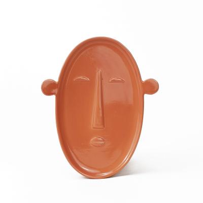 China Contemporary Artistic Embossed Face Vase With Ball Shape Cermic Ears Plate Jewelery Tray Snack Dish for sale