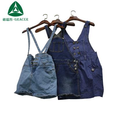 China Package used clothes in women's clothing bullet prices girl denim strap dress and jeans skirt for sale