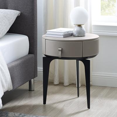 China Contemporary gray leather nightstand mini small luxury modern round bedside table for sale