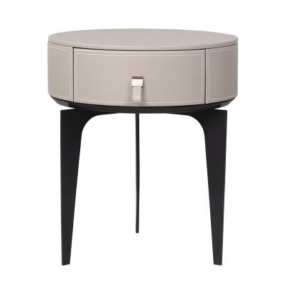 China Contemporary gray leather nightstand mini small luxury modern round bedside table for sale