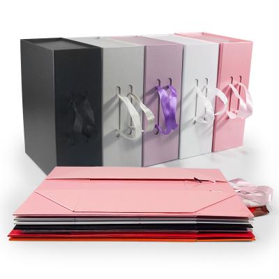 China Recycled Materials Box Cardboard Magnetic Folding Packaging Boxes With Ribbon Luxury Folding Gift Box for sale