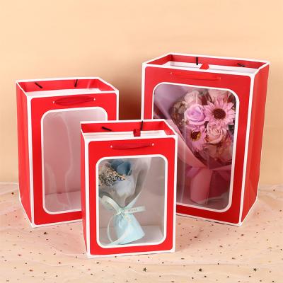 China Recycled Materials Luxury Gift Bags Reusable Customized Boutique Bags Shopping With Logo Clothing Cardboard Bag Packaging for sale