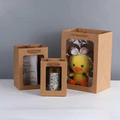 China Recycled Materials Customized Paper Jewelry Boxes Packaging Cardboard Reusable Shopping Paper Clear Window Opening PVC Gift Bag for sale