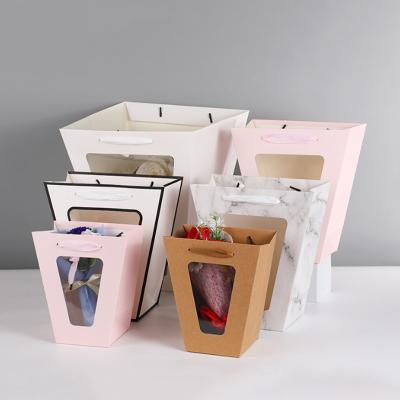 China Recycled Materials Custom Reusable Luxury Shopping Window Bags Logo Printed Small Paper Packaging Bags Wholesale for sale