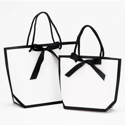 China Recycled Materials Spot Edge Luxury Black Gift Packaging Tote Bag Clothes Bow Gift Shopping Bag for sale