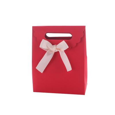 China Recycled Materials Small Bowknot Portable Gift Bag Candy Chocolate Packaging Bag Scarf Clothes Packaging Bag for sale