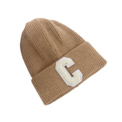 China Custom Logo Winter Woolen Dome Warm COMMON Beanie Knitted Hats And Caps For Men And Women for sale