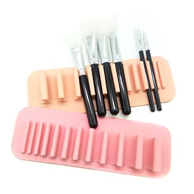 China Beauty Makeup Tools Cosmetic Wall Mounted Suction Toothbrush Home Bathroom Hotel Soft Silicone Makeup Brushes Drying Rack Multifunctional Storage Rack for sale