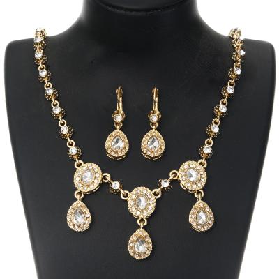 China Alloy Metal Arabic Crystal Jewelry Wedding Ladies Gold Handmade Headwear Water Drop Jewelry Set Chain Head Earring Two Piece Set for sale