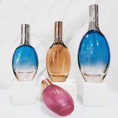 China 30ml 100ml Cosmetic Press Lotion Essence Oval Glass Bottle Face Cream Blue Bottle Cosmetic Glass Bottle for sale