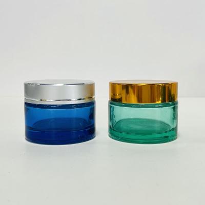 China Factory Wholesale Custom Glass Cosmetic Jars Cosmetic Container Blue Green UV Cream Glass Jar for sale