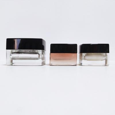 China Cosmetic 20 50g ml Mini Square Glass Cream Jars Glass Cosmetic Jars With Black Cap Custom Any Color for sale