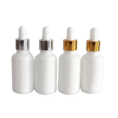 China Cosmetic white ceramic empty essential oil bottle with dropper different color choices 5ml 10ml 20ml 30ml for sale