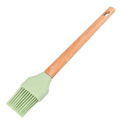 China Best Selling Sustainable Kitchen Silicon Oil Brush Food Oil Brush Disposable Silicone Brush Kitchen Utensil With Wood Handle for sale