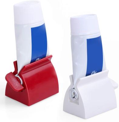 China Viable Rolling Toothpaste Holder Tube Toothpaste Seat Holder Holder Squeezer For Bathroom Accessories for sale