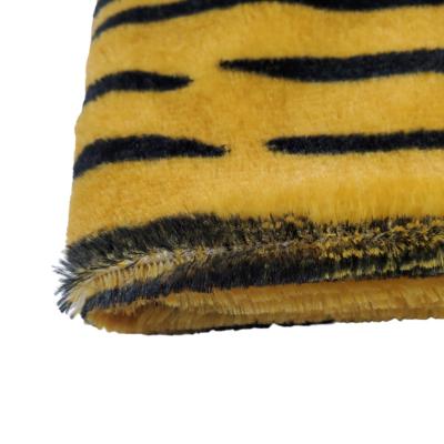 China Undertint Tiger Print PV Plush Top Soft Comfortable Tear-Resistant Fabric For Clothing Toys Faux Fur Hometextile Jackets For Ladies for sale