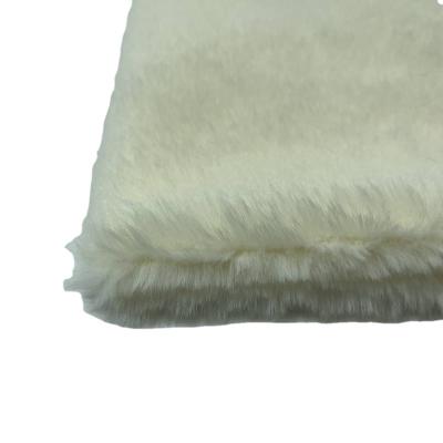 China Toy fur material plush textile fabric tela in rice yellow color for sale