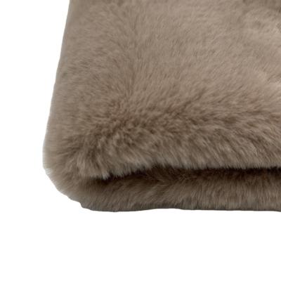 China Tear-resistant faux fur stock fur material in camel piel color tela plush for sale