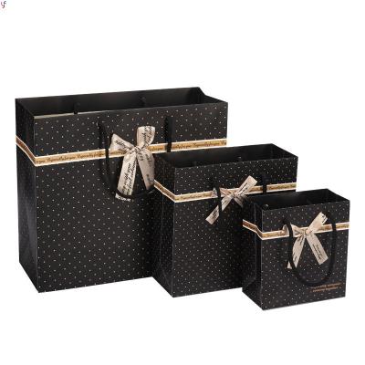 China High Quality Luxury Gold Small Spots On Black Boutique Shopping Tote Clothes Shoes Packaging With Ribbon Bow Paper Gift Bag for sale