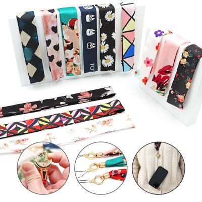 China Silk Cell Phone Lanyard Mobile Phone Chain Luxury Cute Floral Anti-skid Satin Cartoon Silk Neck Strap Long for sale