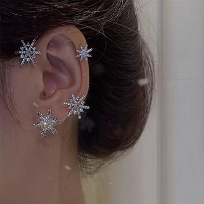 China Fashion Trendy Design Sense Diamond Inlaid Auricle Earrings Snowflake Ear Hanging Clip Pierced Earrings for sale