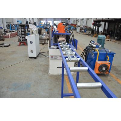 China Hotels 125mm Width Perforated Punch Roll Up Door Roll Forming Machine With Hydraulic Punch for sale