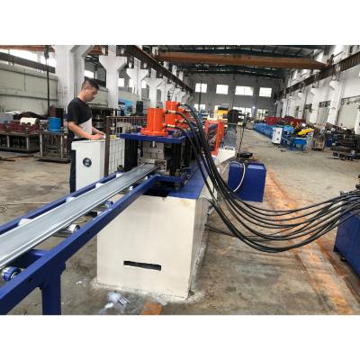 China 125mm Width Perforated Door Slat Hotels America Type Roll Forming Machine With Hydraulic Punch for sale