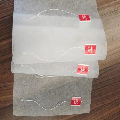 China Nonwoven Food Pack Maker Food Grade Tea Filter Roll Tea Packing With String And Label for sale