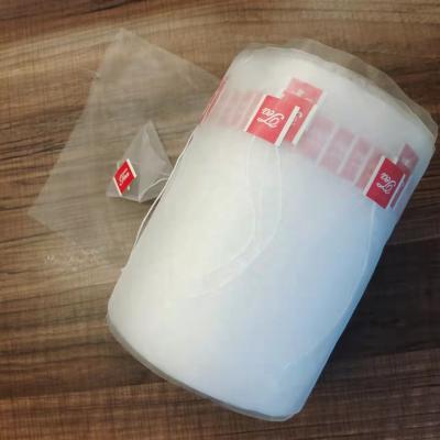 China Wholesale Disposable Nylon Food Packet Mesh Triangle Tea Bag Pyramid Tea Filter Bag Roll for sale