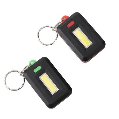 China Hot Selling Emergency Mini Keychain Light 3 Modes Souvenir Gifts 3*AAA Battery Plastic COB Led Flashlight Torch for sale