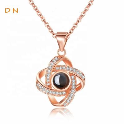 China Dina FASHIONABLE 2021 Women Jewelry Friendship Family Photo Projection Necklace Four Petals Flower Charms Necklace 100 Tongues For Gifts for sale