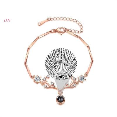 China Zinc Alloy Charm Bracelet 100 Tongues Crystal Bracelet Projection Photo Deer Dina Christmas Custom Personalized Korea Cute Jewelry for sale