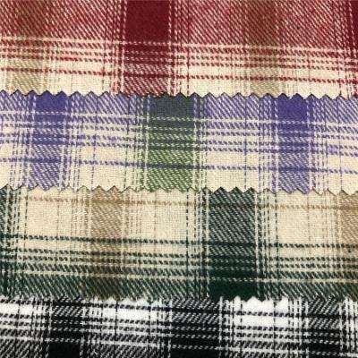 China 2021 Shrink-Resistant Tartan Plaid Brushed Cotton Yarn Dyed Flannel Fabric Stock Lot for sale