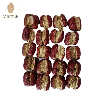 China Good for health Xinjiang jujube with soft waxy red dates mixed with dried fruits and walnut kernel nut and crispy walnuts for sale