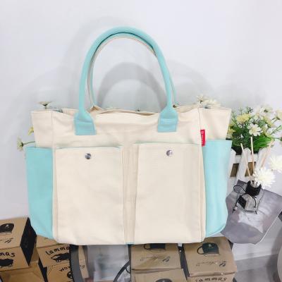 China PACKING BAG Large Capacity Cotton Cloth Diaper Bag Fashionable Baby Diaper Bag for sale