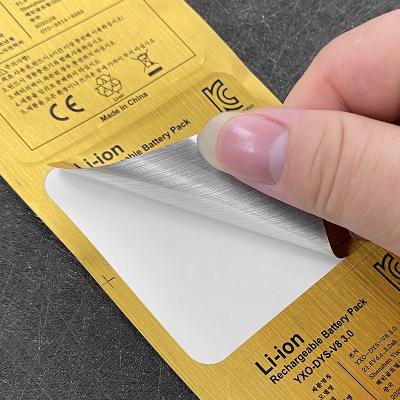 China Waterproof Metallic Gold Brushed Sticker Foil Vinyl Hot Clear Customized Logo Trademark Label Printing Stickers For Electronic Packaging for sale