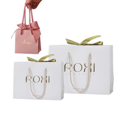 China Customized 250gsm Recyclable Premium Elegant Luxury Jewelry Packaging Gift Jewelry Paper Bags With Satin Ribbon for sale