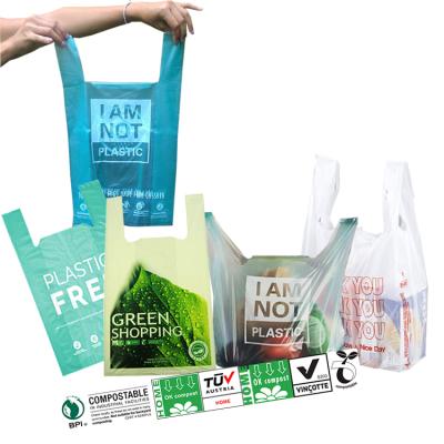 China Eco-Friendly Organic Cornstarch Eco-Friendly Compostable Green T-shirt Bolsas Packaging Custom Logo Degradable Plastic Shopping Carrier Bags for sale