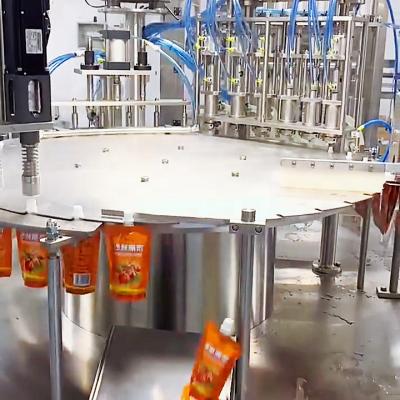 China Automatic Food Stand Up Doypack Sachet Packing Squirted Pouch Ketchup Drinks Liquid Milk Juice Wine Filling And Capping Machine for sale