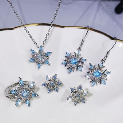 China TRENDY Classic Snowflake Jewelry Set Silver Clavicle Rings Women Chain Three Piece Suit Jewelry Set Luxury Earrings Necklace Rings for sale