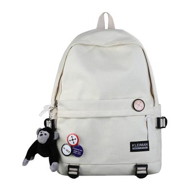 China 2021 new large capacity canvas solid color simple schoolbag college anti-theft cheap sports bag backpack for sale