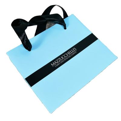 China Recycled Materials Handbag Gift Cosmetic Shopping Bag With Your Logo Jewelry Paper Bag With Satin Handle for sale