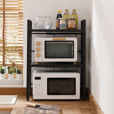 China 2021 Adjustable Multifunctional Kitchen Microwave Oven Rack New Product 2 Tier Microwave Oven Storage Shelf Rack for sale