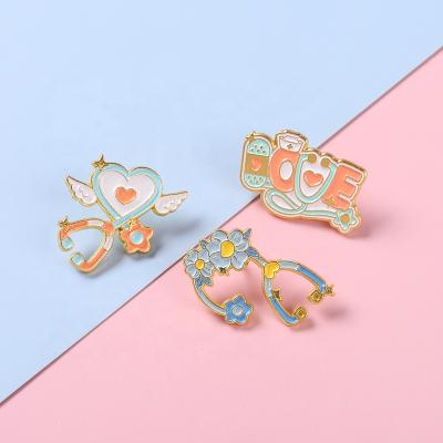 China Europe Bulk Discount Stethoscope Enamel Pin Angle Heart Floral Pill Brooches Doctor Jewelry RN Medical Gifts Health Care Badges for sale