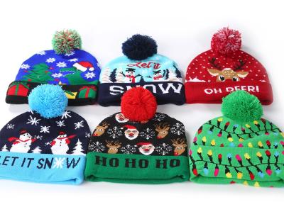 China COMMON Hot Sale Christmas Hat Led Lightweight Winter Knitted Beanie Adults And Kids Size Winter Beanie Hats With Fur Balls for sale