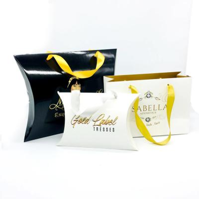 China Custom Unique Recycled Materials Hair Extension Packaging Paper Bag With Ribbon Handle for sale