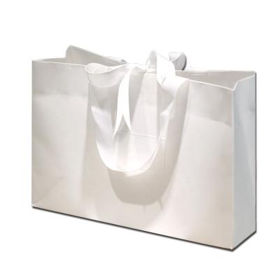 China Guangzhou Recyclable Custom Classy Fancy Private Creative Hand Tied Bow Embossed Logo Paper Gift Bag for sale